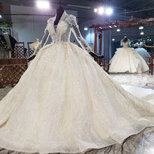 Load image into Gallery viewer, HTL1948 Luxurious Champagne Appliques Crystal Sequined Wedding Dress 2020 Long Sleeve Deep V-Neck Ball Gowns